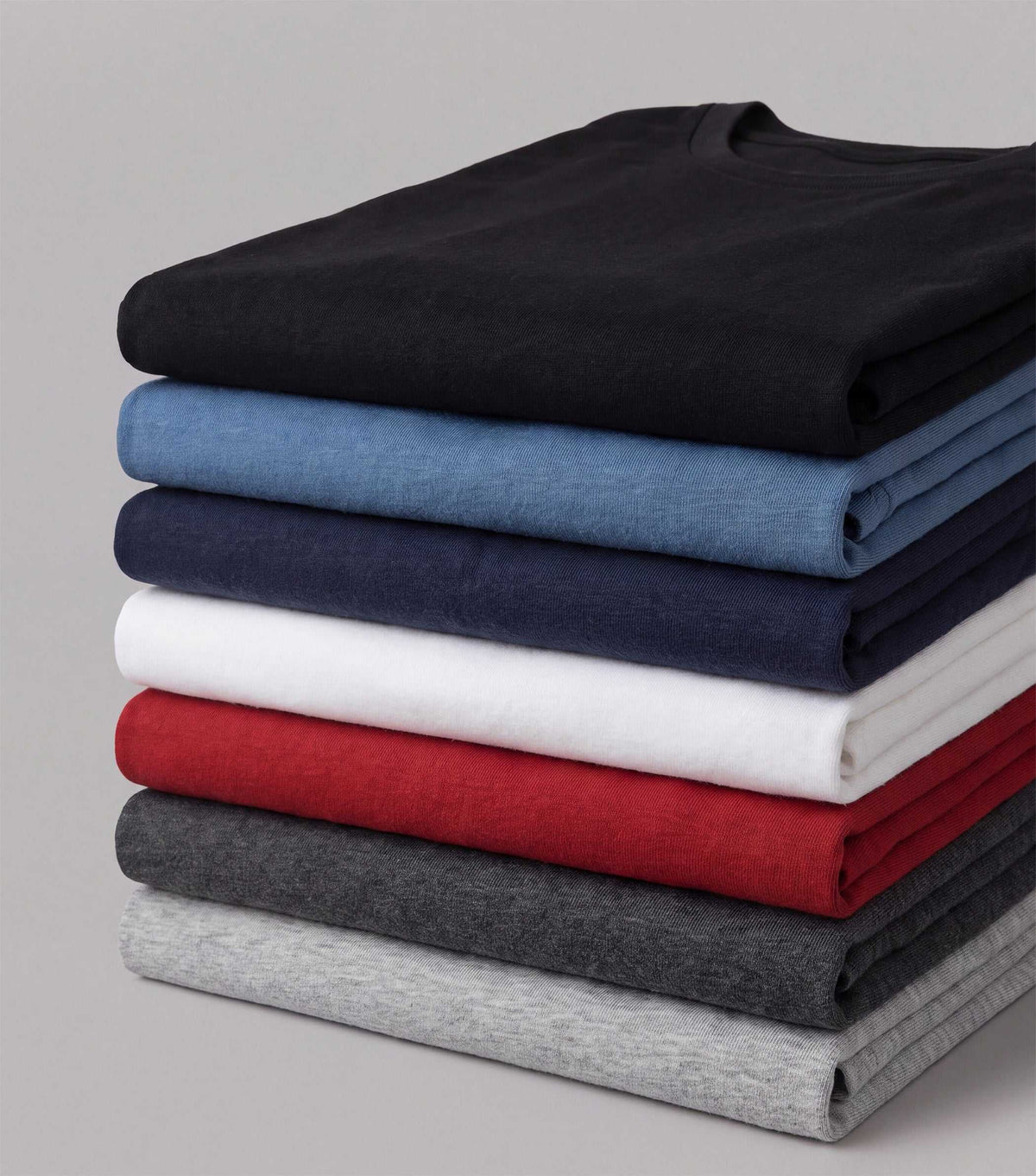 RTG-ALW long-sleeve T-shirts in black, blue, navy, white, red and gray, stacked in solid colors with crew necks.